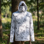 Close-up of hooded fishing shirt on a mannequin outdoors, highlighting fabric texture, zipper details, and high-stretch elasticity in natural light.